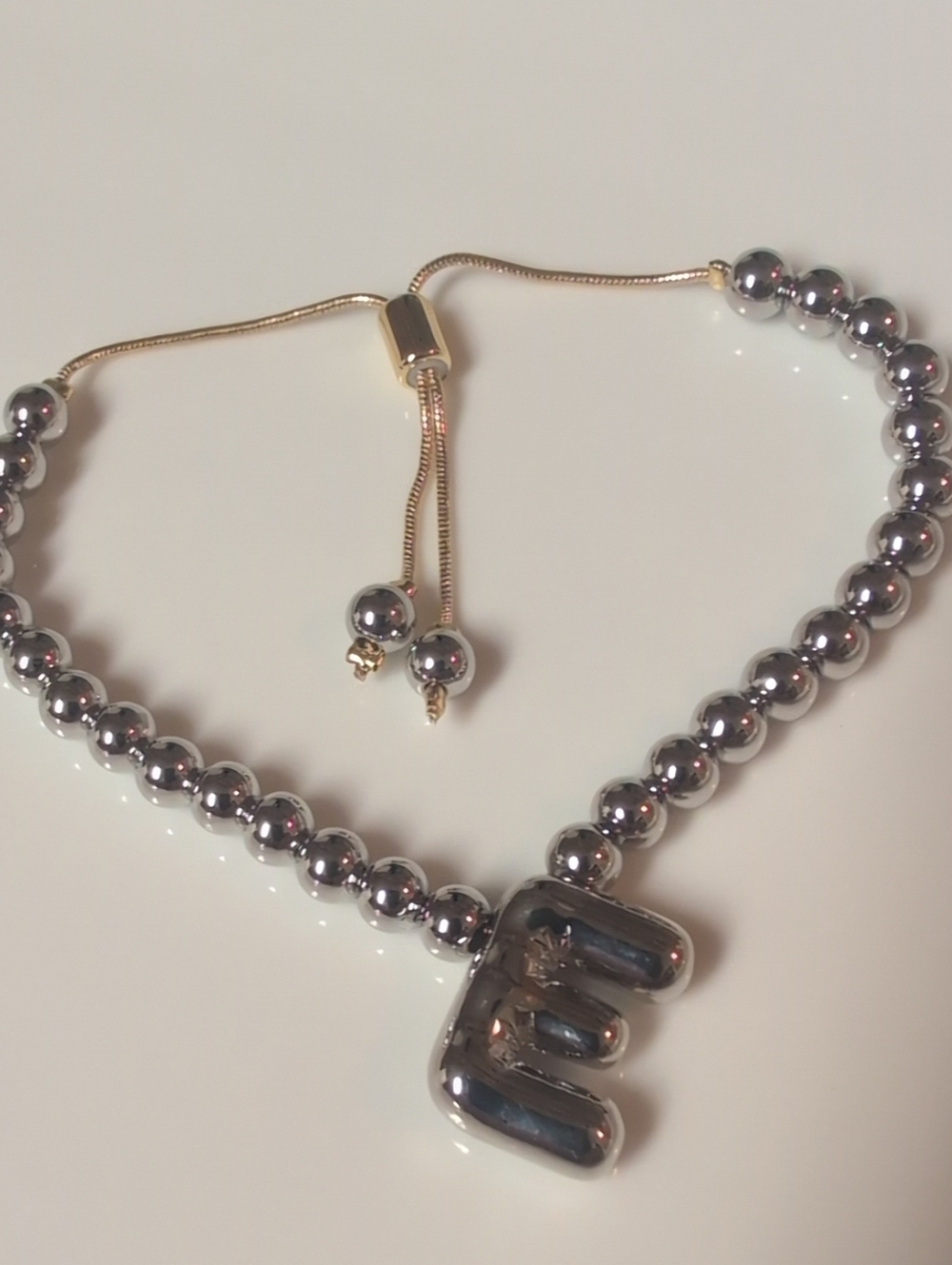 Silver Beaded Bracelet with SilverTone Puffy Charm And Gold Metal Slider Closure